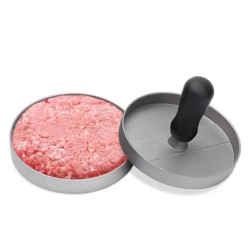 Sort nonstick-burgerpresse med bagepapir