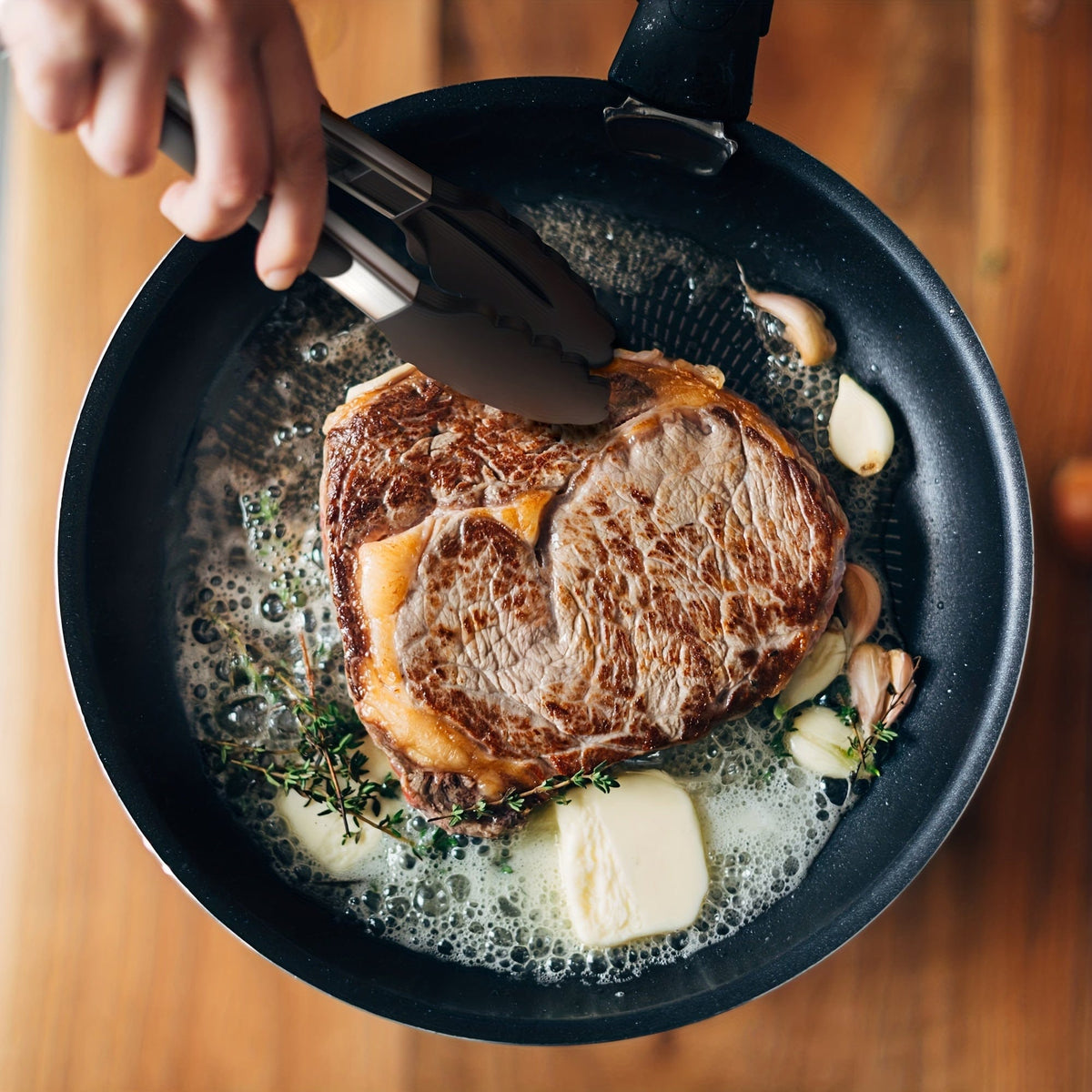 Køkkenflip-flop i rustfrit stål med sorte silikonespidser